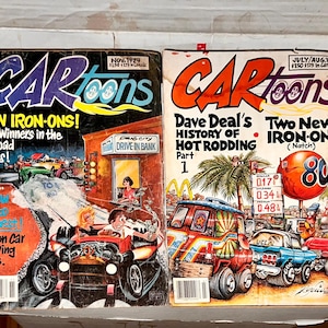 May include: Two vintage issues of CarToons magazine featuring hot rod illustrations. The first issue is from November 1979 and features a new iron-on design. The second issue is from July/August 1980 and features Dave Deal's History of Hot Rodding, Part 1.