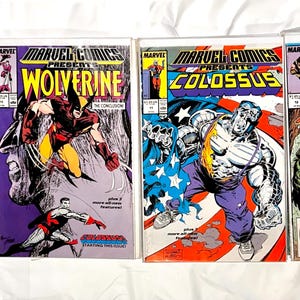 May include: Four vintage Marvel Comics featuring Wolverine and Colossus. The comic book covers showcase vibrant illustrations of the characters in action, with bold colors and dynamic compositions. Each comic is encased in a protective sleeve.