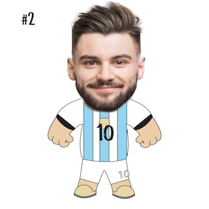 May include: A cartoon illustration of a person wearing a light blue and white soccer jersey with the number 10 on the front and back. The person has a large head and a beard.