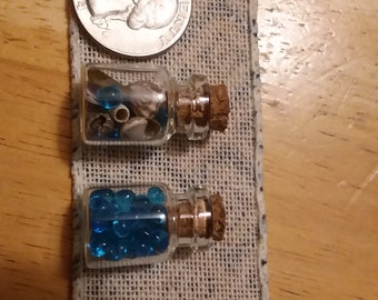 Mini seashells and sea glass in glass jar