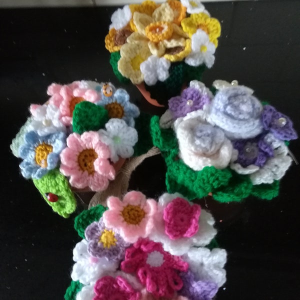 Hand crochet various flowers each design is bespoke in a real terracotta pot .lovely little displays  Birthday  or get well gift