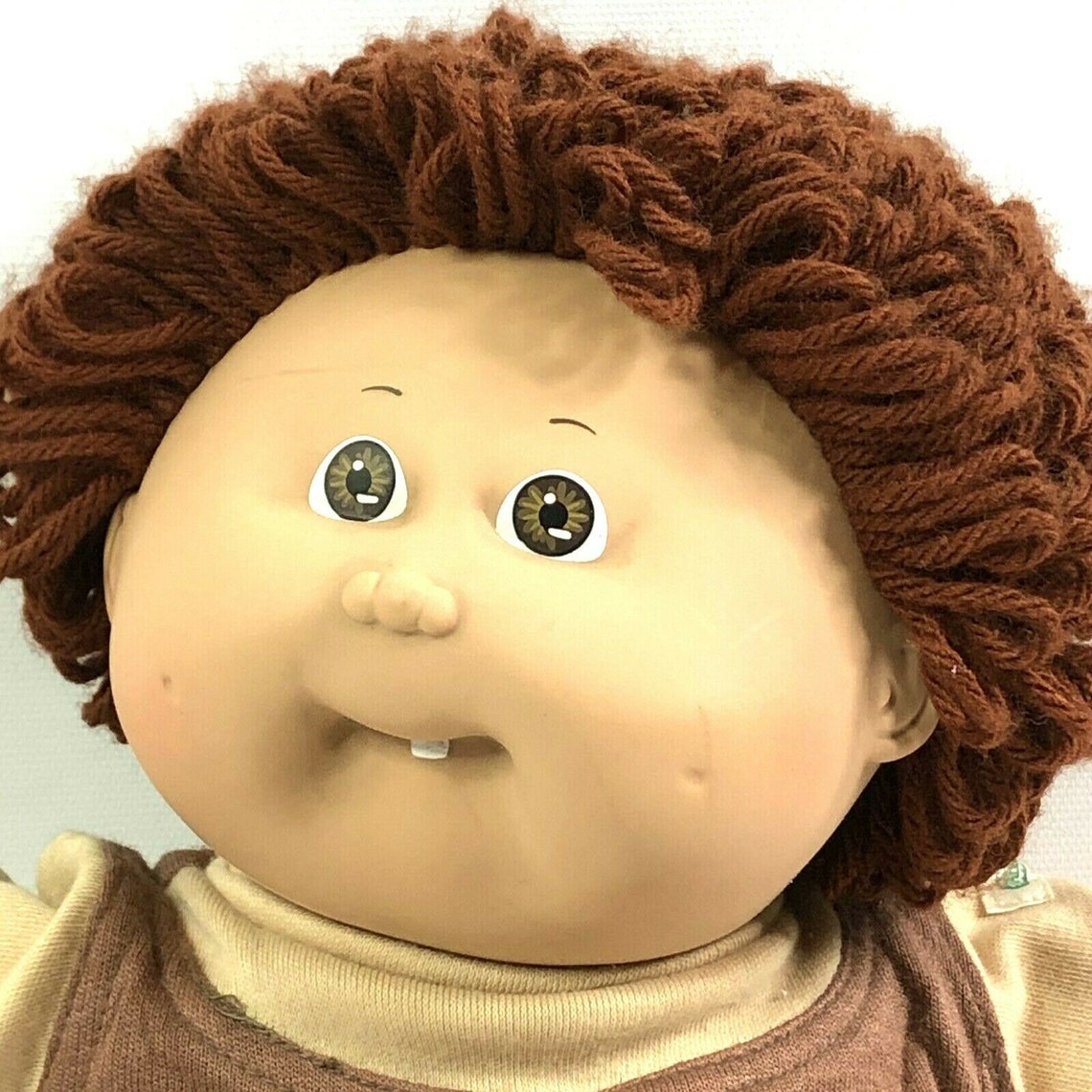 cabbage patch doll with brown yarn hair