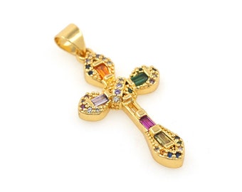 May include: A gold cross pendant with colorful gemstones. The cross is decorated with small clear stones and has a loop at the top for attaching to a chain.