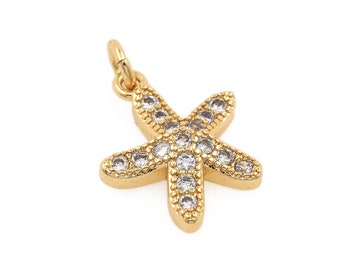 May include: Gold-tone starfish charm with clear crystal accents.