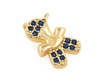 May include: Gold charm in the shape of a person with blue crystal accents.