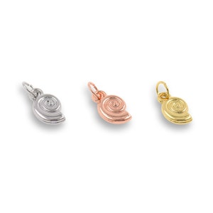 May include: Three silver, rose gold, and gold seashell charms. Each charm features a detailed spiral design.