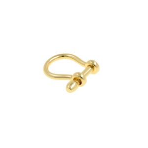 May include: A gold-colored shackle, a U-shaped metal fastener with a pin closure. The shackle is made of a shiny, reflective metal and is set against a plain white background. The design is simple and elegant.
