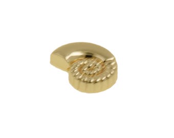 May include: A small, gold-colored, seashell-shaped object. The top portion is smooth and curved, while the bottom section features a textured, spiral design. The object is set against a plain white background.