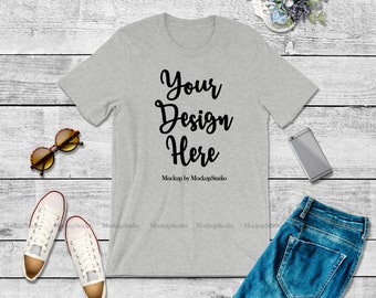 Download Free Bella Canvas 3001 Athletic Heather Gray Unisex Women T-Shirt Mock Up, Grey Shirt Flat Lay Tee Apparel Youth Shirt Wood Background Mockup PSD Template