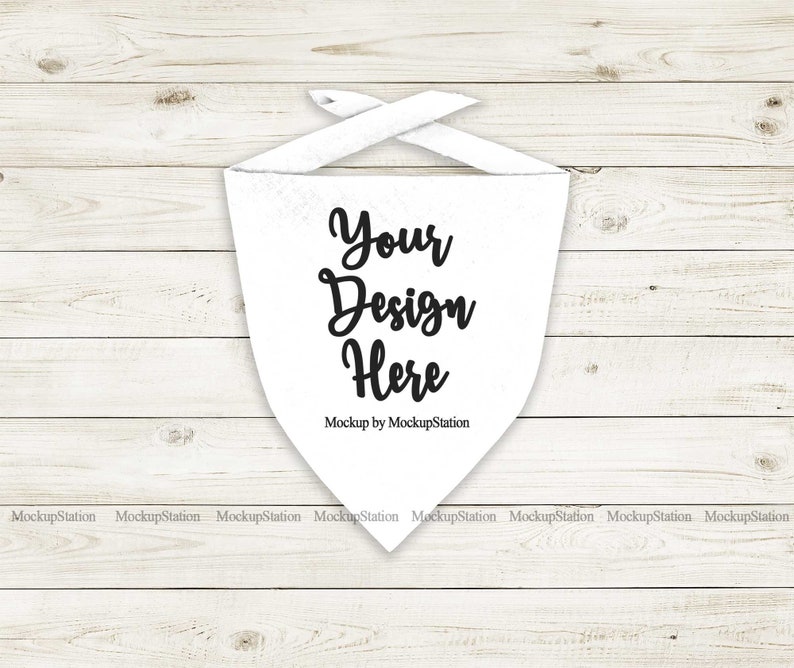 May include: White bandana mockup on a white wood background. The bandana has the text "Your Design Here" and "Mockup by MockupStation" printed on it.