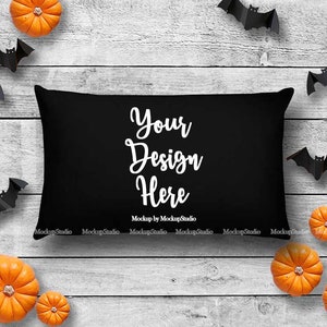 May include: Black pillow with white text that says "Your Design Here" on a white wood background with orange pumpkins and black bats.