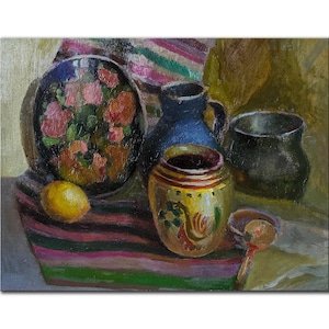 May include: Oil painting of a still life featuring a black bowl with pink floral designs, a blue pitcher, and a yellow jar with a rooster motif. A lemon and small bowl with a spoon are also present. The objects rest on a striped cloth.
