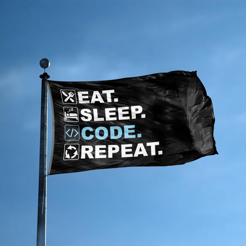 A flag with the saying "Eat Sleep Code Repeat" displayed on a high pole, with a black and white color scheme.