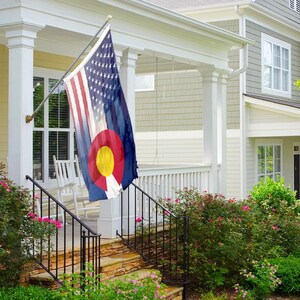 a living room with a guitar and a flag on the wall