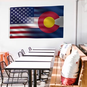 a couple of flags that are next to each other