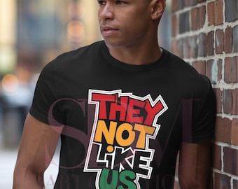 They Not Like Us T-Shirt | Unisex Black Pride Tee | Afrocentric Graphic Shirt | Bold Statement Tee | RBG Pan-African Colors Shirt