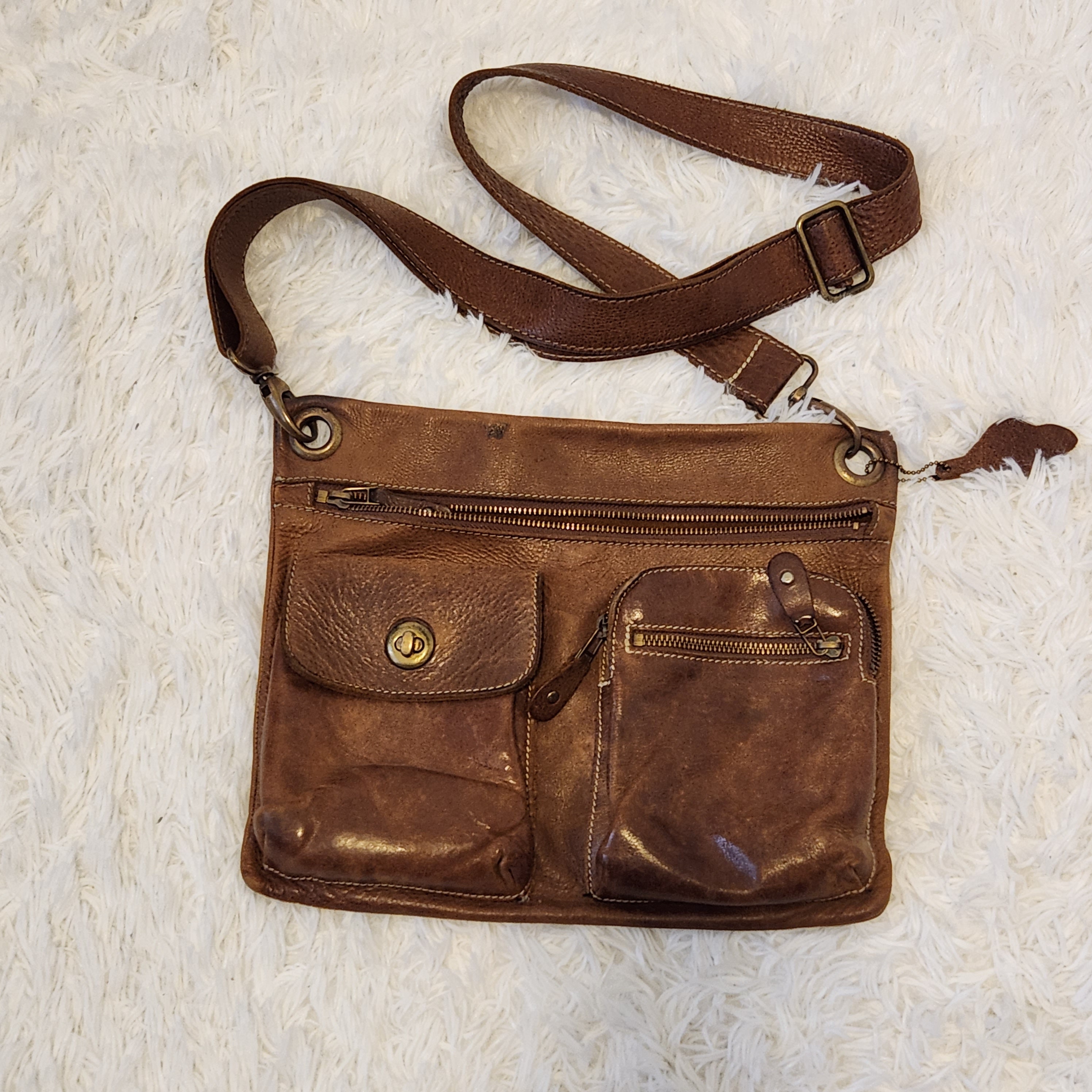 Roots village bag deals