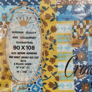 May include: A yellow and blue patchwork design bed sheet set with a label that says "Superior Quality and Colourfast Guaranteed 90 x 108 Size Before Hemming. One Sheet Double Bed Size with 3 Pillow Cases: 18" x 28" (2) 14 1/2" x 42" (1)"