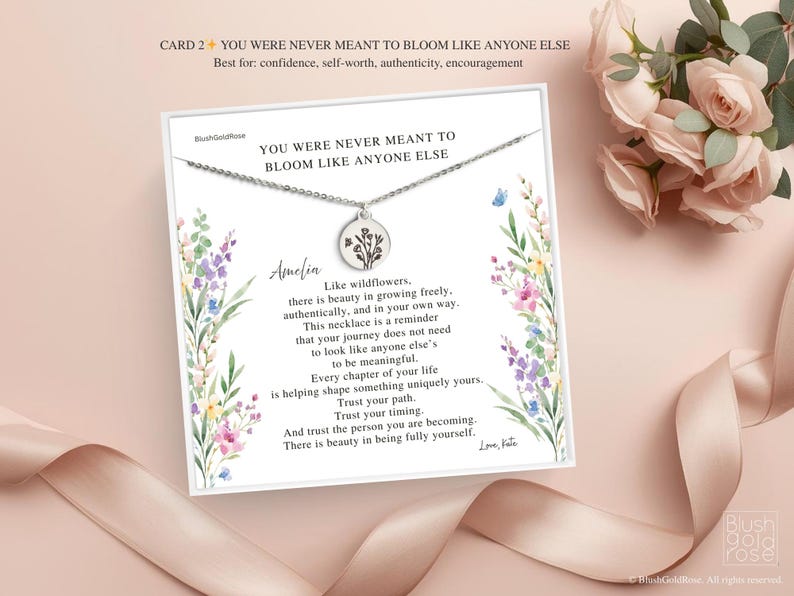May include: A silver necklace with a round pendant featuring a floral design, presented on a card with the text "YOU WERE NEVER MEANT TO BLOOM LIKE ANYONE ELSE". The card has a floral watercolor design and the name "Amelia".