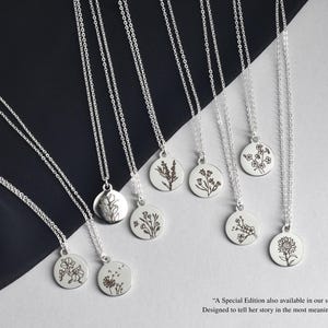 May include: A collection of silver necklaces with round pendants, each featuring a different floral design. The necklaces hang against a black and white backdrop. The text in the image says "A Special Edition also available in our shop" and "Designed to tell her story in the most meaningful way".