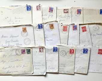May include: A collection of vintage envelopes, many with stamps and postmarks. The envelopes are white and cream-colored, with handwritten addresses and various stamp designs, including portraits and historical figures. Some envelopes have postmarks from the 1950s.