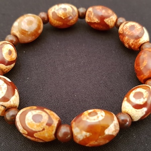 Tibetan triple eyed dZi bead stretch bracelet