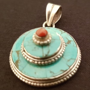 Vintage sterling silver coral and turquoise Tibetan gau shaped pendant