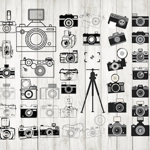 May include: A collection of black and white vintage camera illustrations. The cameras are drawn in various styles, including film cameras, digital cameras, and instant cameras. Some cameras have flashes, lenses, and other accessories.