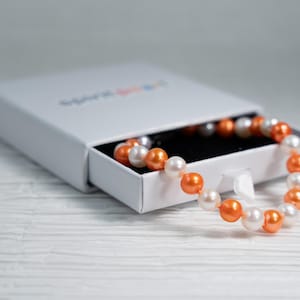 University of Tennessee - 7.5" Orange & White Freshwater Pearl Bracelet - Handstrung with Sterling Silver Clasp. GO VOLS!