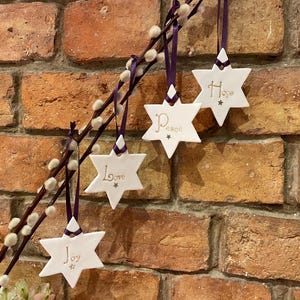 Peace, joy, love and hope Christmas star decorations - Set of four.