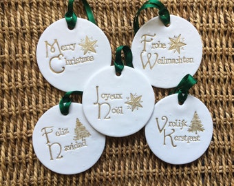 Merry Christmas - Christmas circular decoration in different languages. Opportunity to add a name to the decoration.