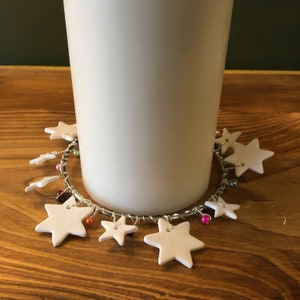 Handmade star and bead Christmas candle skirt