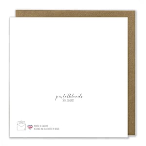 May include: A white card with a brown envelope border. The card has the text "pastelblends with Somerset" printed in black. The bottom of the card has a small image of a letter with a heart and the text "Printed in England. Designed and illustrated by Abigail."
