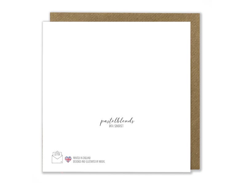 May include: A white card with a brown envelope border. The card has the text "pastelblends with Somerset" printed in black. The bottom of the card has a small image of a letter with a heart and the text "Printed in England. Designed and illustrated by Abigail."