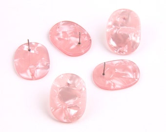 Può includere: Quattro orecchini ovali di colore rosa con effetto marmoreo. Gli orecchini hanno un perno argentato.