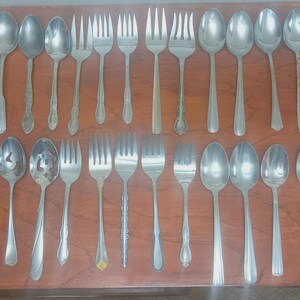 Lot of 34 mismatched vintage serving utensils - serving Spoons, meat forks
