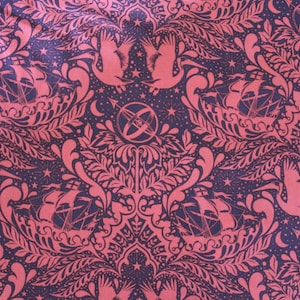 May include: A pink and navy blue fabric with a repeating pattern of stylized birds, ships, and stars. The pattern is reminiscent of a traditional damask design.