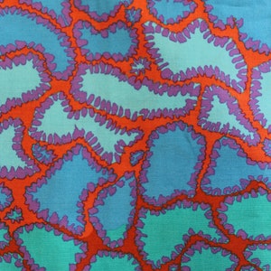 May include: Abstract textile pattern featuring organic shapes in shades of teal, blue, and purple, outlined in a vibrant orange. The design has a retro, psychedelic feel, reminiscent of 1960s and 70s art and fashion.
