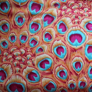 May include: A fabric with a peacock feather pattern. The feathers are a mix of orange, pink, and blue.