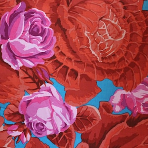 May include: A vibrant floral pattern featuring large, stylized roses in shades of pink and magenta against a backdrop of deep red foliage. The design includes a bright turquoise blue background, creating a striking contrast.