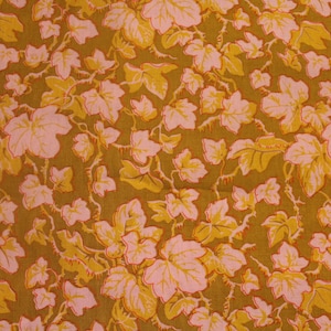 May include: A fabric with a repeating pattern of pink and yellow leaves on a brown background.