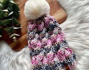 Handknit multicoloured cable stitch beanie with removable pompom