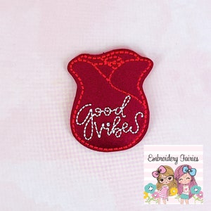May include: Red felt rose with white embroidery that says "Good Vibes".