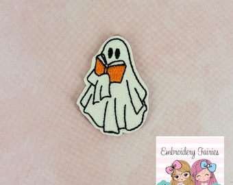 May include: A white ghost with a black outline is reading an orange book. The ghost has two black eyes and a small mouth. The ghost is on a pink background.