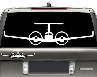 May include: A white silhouette of a twin-engine airplane on a black background. The airplane is facing forward with the wings spread out. The airplane is on a car window.