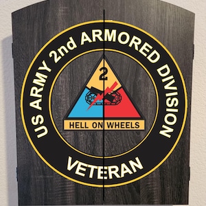 May include: A dark gray wood-grain cabinet with a circular US Army 2nd Armored Division emblem. The emblem features a yellow, blue, and red triangle with a black tank track and lightning bolt, the text HELL ON WHEELS, and VETERAN.