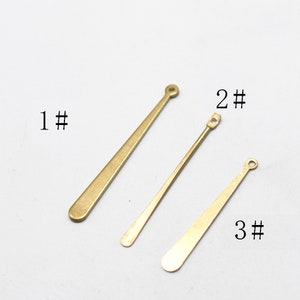 May include: Three gold-colored metal pieces with rounded ends. The pieces are labeled 1#, 2#, and 3#.