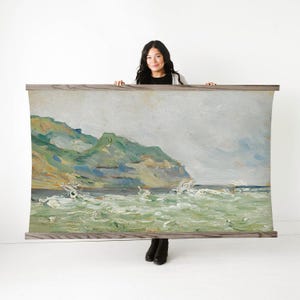 May include: A large landscape painting depicting a coastal scene with green and yellow hills, and a turbulent sea. The artwork is mounted on a wooden frame, showcasing a blend of natural colors and textures.