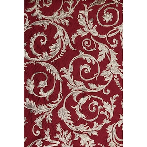 May include: Red fabric with a gold damask pattern. The pattern features swirling vines and leaves.