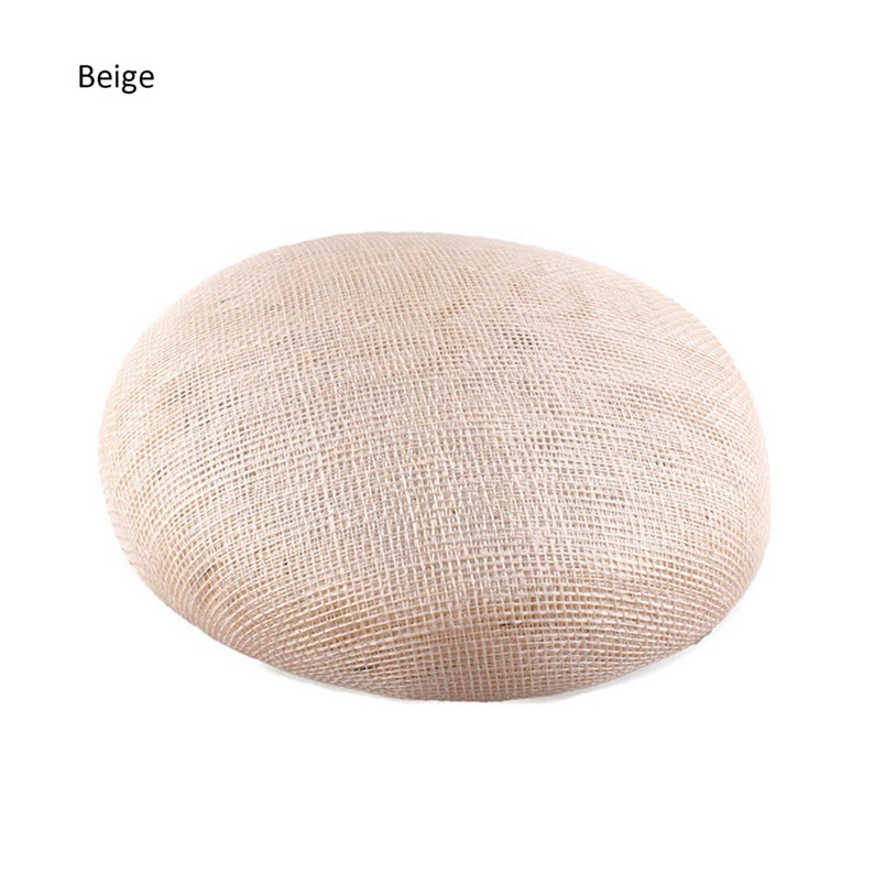 May include: A set of three ceramic mugs with a speckled, matte finish. The mugs are in shades of gray, white, and black. Each mug has a simple, modern design and a rounded handle. The mugs are likely for coffee or tea.
